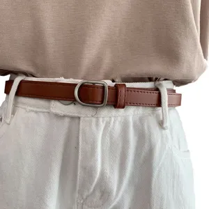 Retro brown thin PU leather belt for women, versatile waist accessory for casual jeans and trousers.
