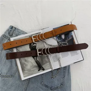 Punk style chain leather belt detail, vintage double brown belts with metal rings and chain.