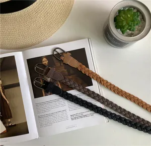Detailed view of women's braided belt set featuring classic pin buckles, retro style accessory.