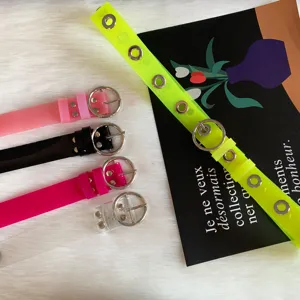 Colorful transparent PVC jelly belt with metal eyelets and round buckle, trendy style.