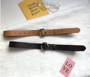 Close-up details of women pu leather belts featuring trendy metallic hexagonal buckle accessories.