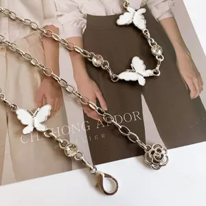 Silver metal pants chain body chain featuring white butterflies and sparkling rhinestones.