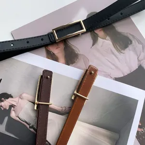 Detailed view of minimalist women thin leather belts with metallic rectangular buckles.