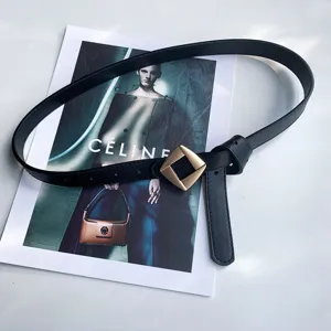 Black leather belt detail highlighting the unique geometric diamond gold buckle and fine craftsmanship.
