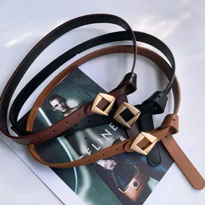 Women's minimalist leather belt with stylish geometric buckle, classic black and brown detail.