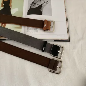 Detail shot of stylish Korean fashion belts with square metal buckles for men and women.