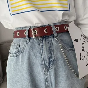 Women punk style burgundy leather grommet belt detail with silver metal eyelets and chain.