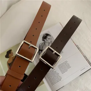 Classic square buckle leather belt for men and women, minimalist fashion design for daily wear.