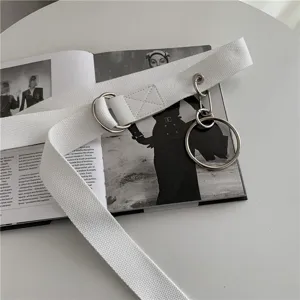 White canvas belt with metal double rings and unique hanging ring detail for cargo pants.