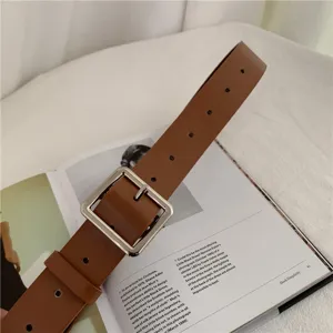 Classic brown leather belt featuring a sleek square metal buckle for daily fashion wear.