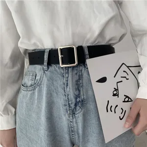 Detailed view of unisex black leather belt with minimalist square metal buckle for daily wear.
