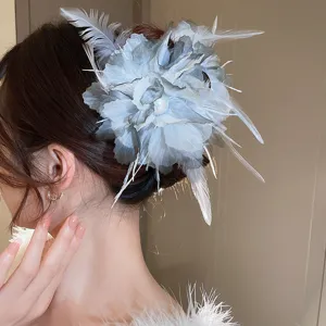Exquisite pearl feather flower hair claw clip for elegant hairstyles, detail view.