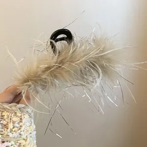 Feather hair claw clip with sparkly tinsel details, elegant back head hair styling accessory.