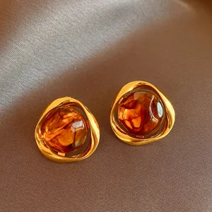 Retro brown geometric earrings with metal frame and amber resin center, elegant chic design.