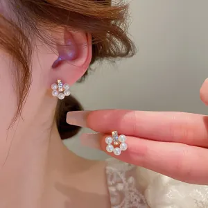 Elegant pearl floral stud earrings with sparkling rhinestones, perfect for daily wear and chic styles.