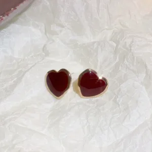 Red heart enamel earrings with gold edges, elegant and stylish minimalist design for women.