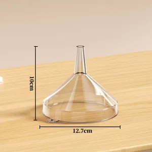 Transparent plastic funnel for liquid dispensing, compact mini size, durable kitchen tool.