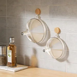 Transparent flat plastic funnel with wooden wall hook for kitchen and liquid sub-bottling.