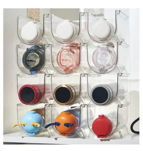 Clear stackable water bottle organizer detail, multi-layer cup storage rack display.