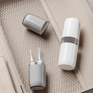 Portable travel toothbrush holder and mouthwash cup set for convenient outdoor trips.