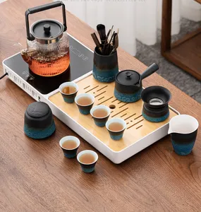 Set da tè automatico con bollitore elettrico e vassoio in legno per tè kung fu domestico.