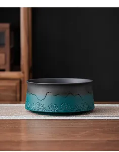 Detailed view of the ceramic tea wash bowl featuring a gradient finish and wave relief carvings.