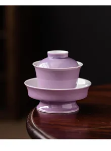 Exquisite purple ceramic gaiwan tea cup with saucer, elegant kung fu tea set detail view.