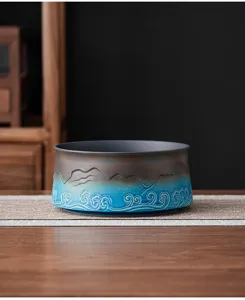 Exquisite ceramic tea wash basin detail, featuring blue relief waves for Zen tea setup.