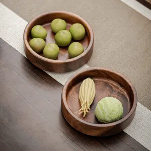 Plat à snack en bois de noyer plateau rond créatif petite soucoupe pour fruits secs et thé.