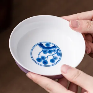 Hand-painted purple ceramic tea saucer with blue pine pattern for kung fu tea set use.