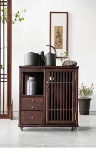 Solid wood tea cabinet detail view, showcasing smooth sliding drawers and elegant slatted door.