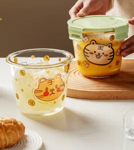 Detailed shot of cute tiger print glass soup bowl with airtight green lid, perfect for food storage.