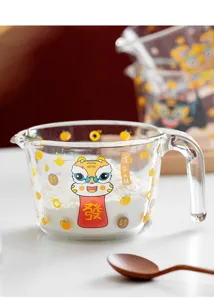 Clear glass measuring cup with cute tiger design for kitchen baking, high temperature resistant.