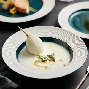 Elegant ceramic pasta bowl with modern spiral rim design for fine dining and stylish home table.