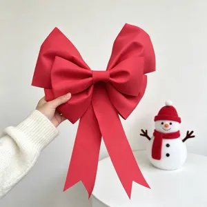 Detailed view of large red EVA bow for Christmas and wedding festive party decoration.