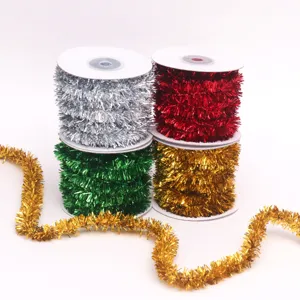 Detail view of metallic tinsel Christmas tree garland ribbons in four bright colors.
