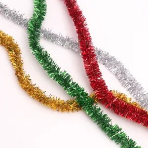 Close-up detail of metallic Christmas tinsel garland, flexible wire interior for DIY party decor.