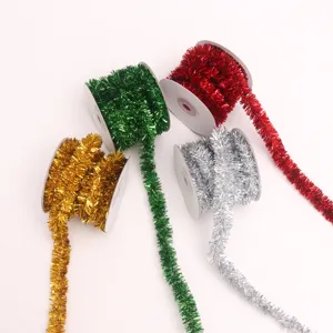 Close up view of metallic tinsel wire ribbons in gold, green, red and silver for decoration.