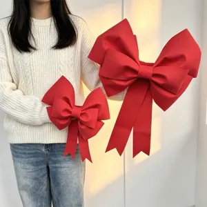 Detail shot of large red EVA bow Christmas and wedding party hanging decoration props.