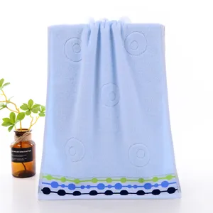 Cotton face towel blue soft bathroom towel with embossed circles and dotted border SKU