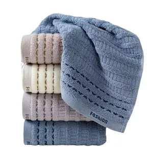 Thickened absorbent cotton face towel set with striped design and soft texture for home daily use.