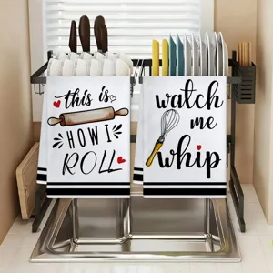 Kitchen hand towel detail featuring funny baking slogans and cute illustrations for home use.