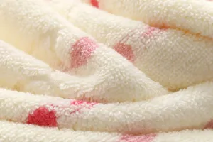 Soft cotton face towel detail, thickened jacquard loop terry fabric with pink polka dot design.