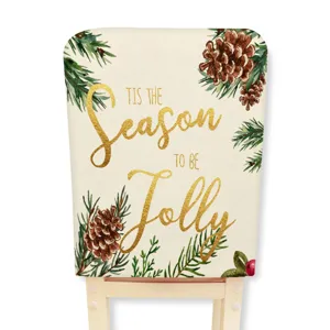 Christmas chair cover with pine cones and gold holiday text, ideal for home dining decor.