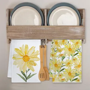 Detailed view of fresh watercolor daisy kitchen towels with sunflower print, charming home decor.
