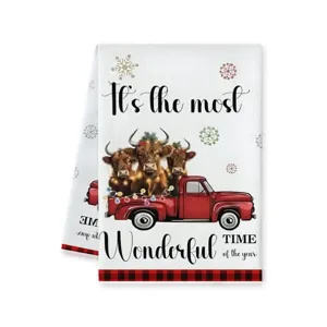 Close-up detail van de kerst hoogland koe rode truck feestelijk theedoek keukentextiel