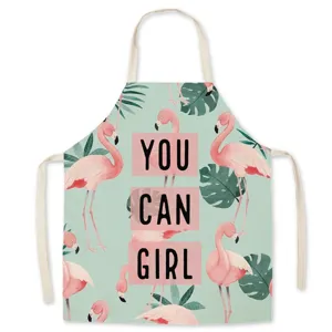 Linen flamingo print kitchen apron with tropical leaf design, stylish cooking bib for women.