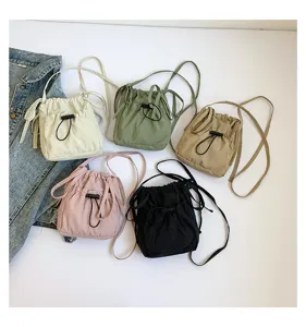Nylon drawstring bucket shoulder bag casual solid color crossbody bag detail view style.
