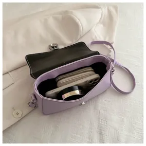 Detailed view of a light purple minimalist shoulder bag showcasing its interior capacity.