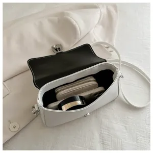 White French retro shoulder bag capacity detail showing interior space and daily essentials.